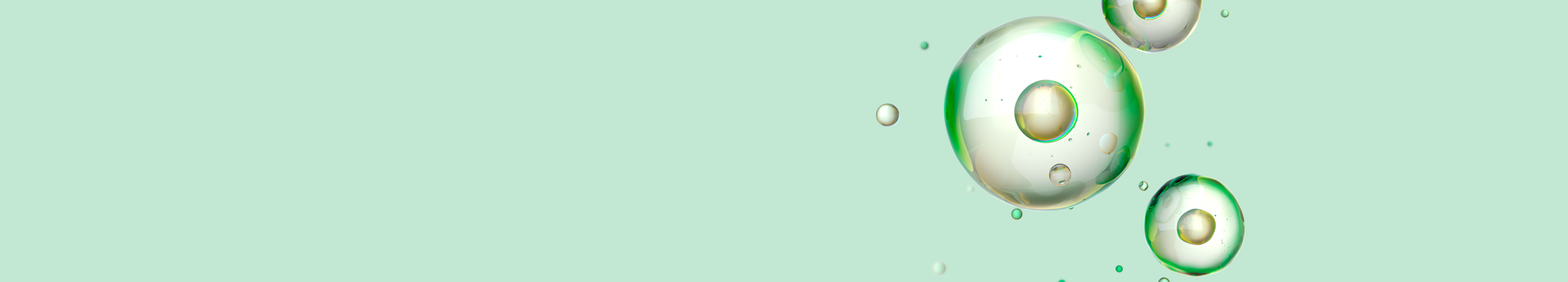 banner image of green and white translucent cells floating against a light green background.