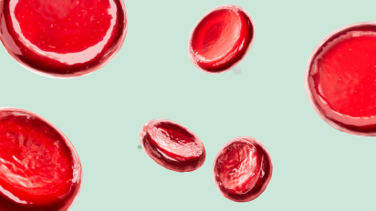 A 3D rendering shows bright red blood cells floating at varying sizes and angles against a pale green background.